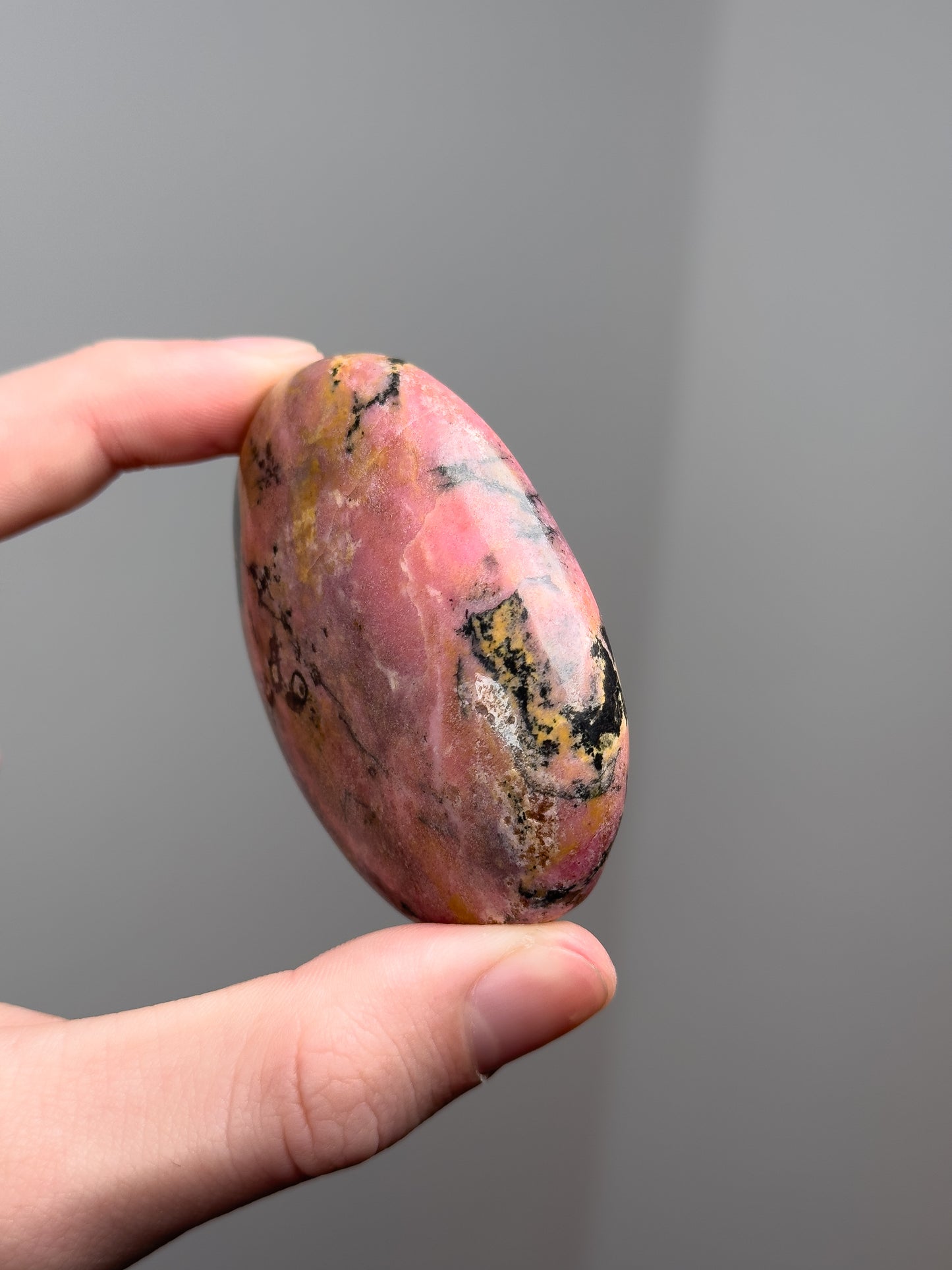 Rhodonite palm stone