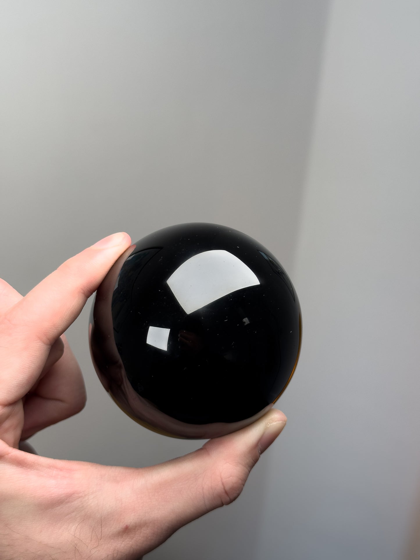 Gold sheen obsidian sphere